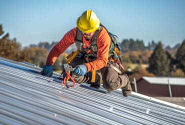 roofing worker install new roof