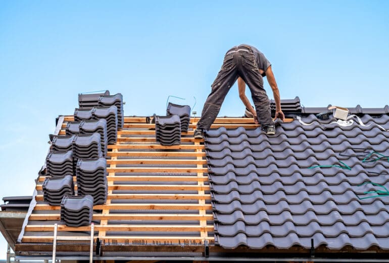roofing expert working on roof repair