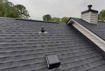 Newly Installed Black Asphalt Architectural Shingles on a Residential Home