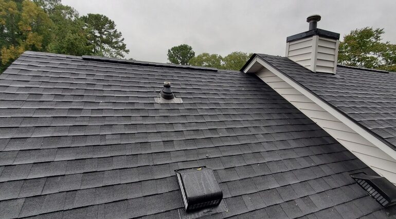 Newly Installed Black Asphalt Architectural Shingles on a Residential Home