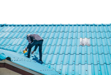 Contractor repairing broken roof