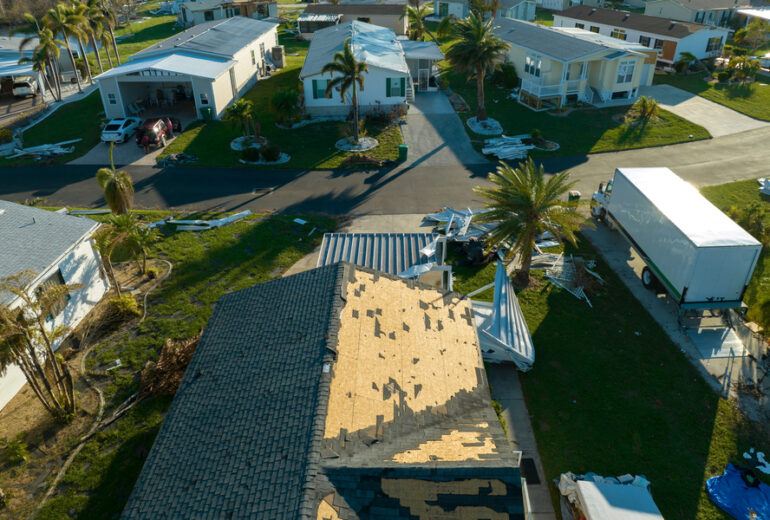 Badly damaged roofs after hurricane Ian in Florida Southwest region residential area