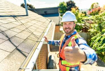 roofing expert shoing a thumbsup after roof inspection