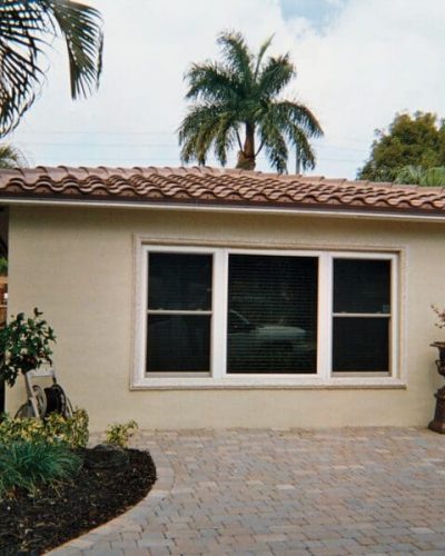 beautiful home with surrounded palm trees